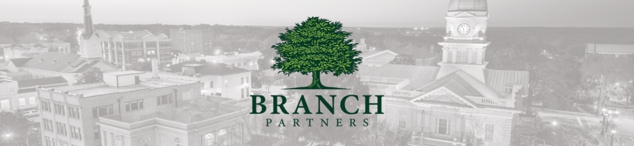 A large green tree logo with 